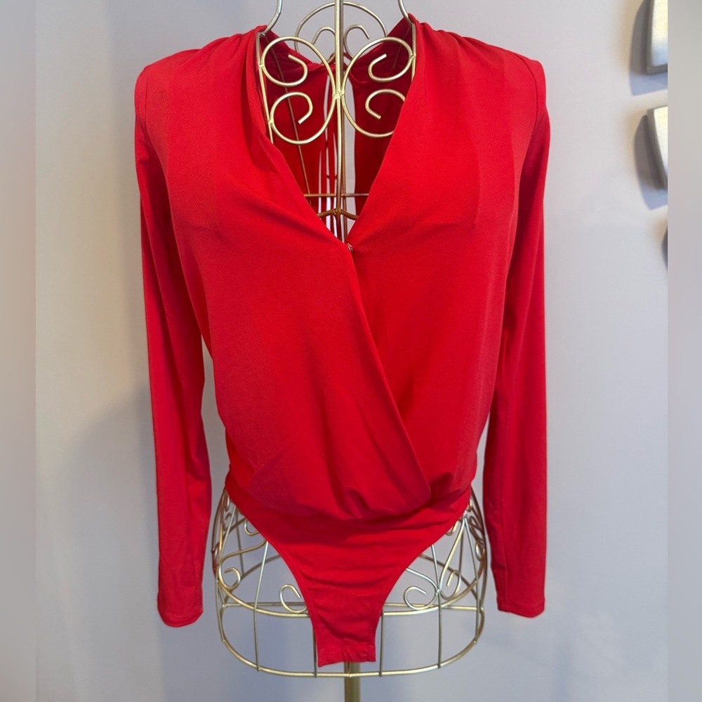 BCBGeneration red long-sleeve bodysuit in size XS